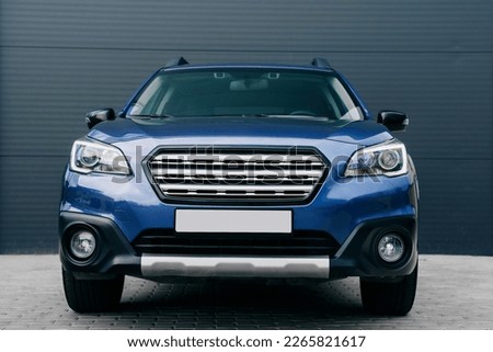 Modern subcompact crossover SUV,  beautiful wheels, large chrome grille. Royalty-Free Stock Photo #2265821617