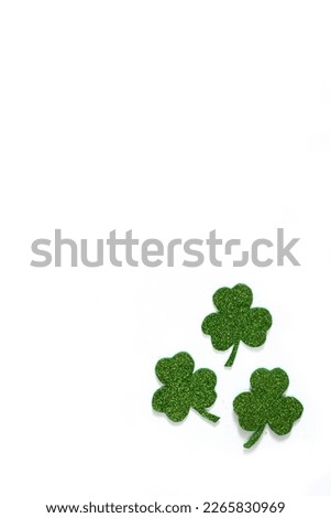 Happy St. Patrick's Day banner.Holiday background.St Patricks Day frame against a white background. Flat lay shamrocks.Copy space.Patrik's day banner