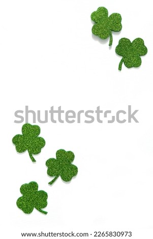 Happy St. Patrick's Day banner.Holiday background.St Patricks Day frame against a white background. Flat lay shamrocks.Copy space.Patrik's day banner Royalty-Free Stock Photo #2265830973
