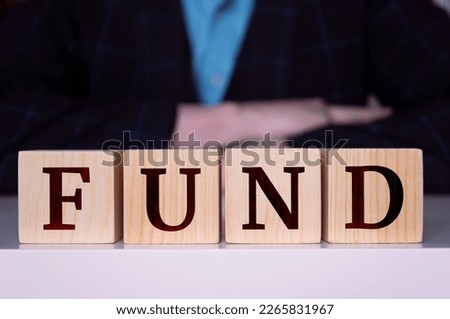 The word "Fund" written on wood cube. Business concept