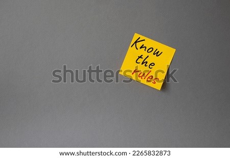 Know the rules symbol. Concept words Know the rules om orange steaky note. Beautiful grey background. Business and Know the rules concept. Copy space.