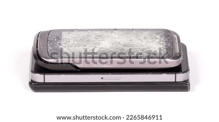 Broken display screen smartphone (stack) on a white background