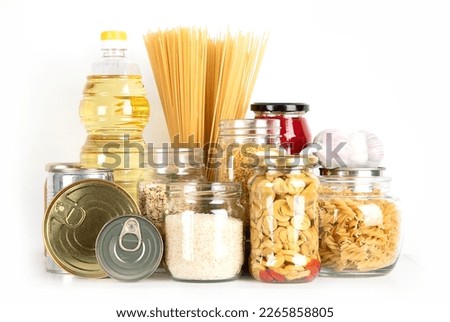Food supplies. Crisis food stock. Different glass jars with grains, pasta, oil, nut, canned food