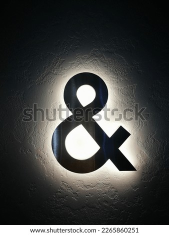 The ampersand, also known as the and sign, is the logogram , representing the conjunction "and". It originated as a ligature of the letters et—Latin for "and"	