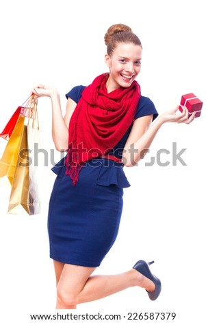 Fashion Shopping Girl Portrait. Beauty Woman with Shopping Bags in Shopping Mall. Shopper. Sales. Shopping Center 
