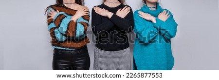 The girls hug themselves. Concept for March 8th, #IWD2023, #EmbraceEquity, International Women's Day. Royalty-Free Stock Photo #2265877553