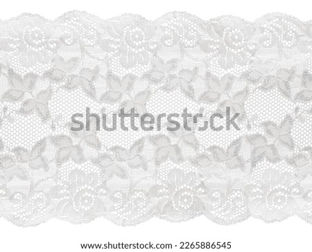 piece of white lace with floral pattern on a white background Royalty-Free Stock Photo #2265886545
