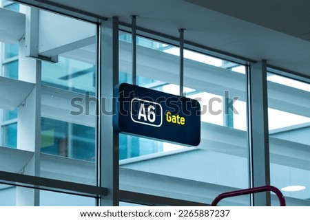 Finding Your Way: A Vibrant Image of a Gate Sign in the Airport - Perfect for Travel and Navigation Themes. Get Ready to Board Your Flight with This Clear and Easy-to-Read Sign Displaying Your Gate