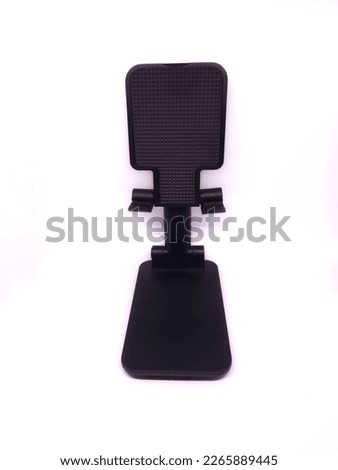 photo of a smartphone or tablet coaster with a white background 