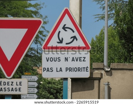 Regulatory signs, give way or yield traffic sign written in French: Vous n'avez pas la priorite translated You do not have any priority rights