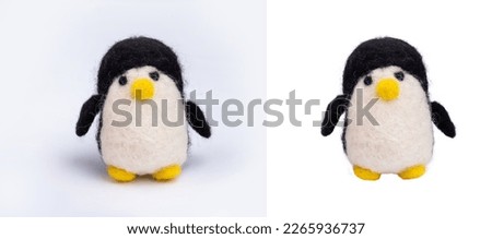 Felting activity. felted penguin made of wool isolated on white background. wool brooch, handmade