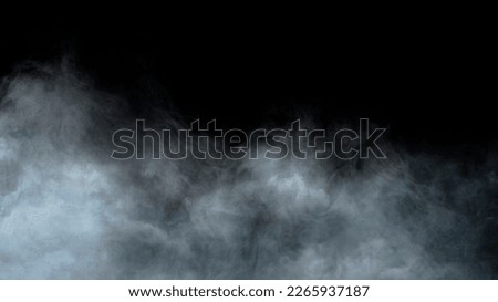 Realistic dry ice smoke clouds fog overlay perfect for compositing into your shots. Simply drop it in and change its blending mode to screen or add. Royalty-Free Stock Photo #2265937187