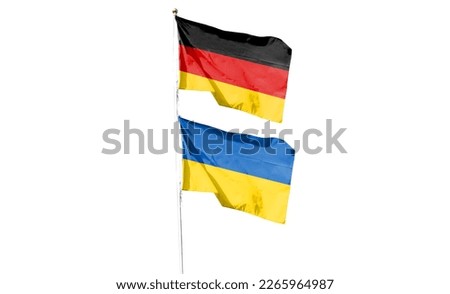 German flag and Ukrainian flag on cloudy sky. waving in the sky