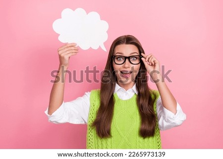 Photo of astonished pretty lady hold white paper card rejoice came conclusion know answer decision isolated on pink color background