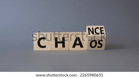 Chance vs Chaos symbol. Turned wooden cubes with words Chaos and Chance. Beautiful grey background. Psychology and Chance vs Chaos concept. Copy space
