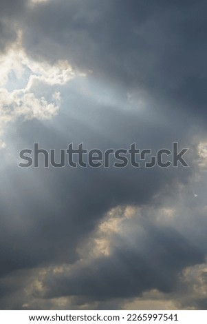 Cloudy sky with sun rays