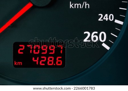 red digital odometer of an old car with red digits, considerable mileage, mileage Royalty-Free Stock Photo #2266001783