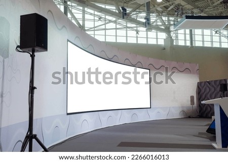 Multimedia blank large white interactive wall display at modern technology exhibition, museum, trade show. Mock up, white screen, copyspace, template, education concept