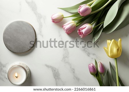 Flowers creative composition. Mother woman day. Pink tulips and leaves with burning candles isolated on white marble. mock up. view, copy space. top. flat lay

