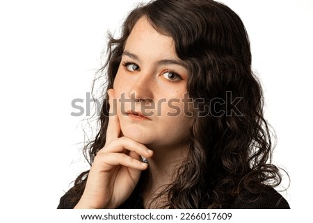 Woman with curly hair with serious look isolated on white background