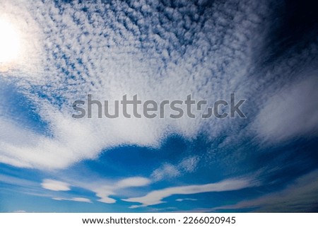 Cirrocumulus are formed by the deformation of Cirrus or Cirrostratus clouds or by the shrinkage of fragmented Altocumulus. Royalty-Free Stock Photo #2266020945