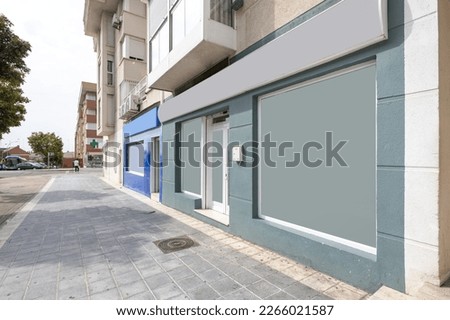 Facades of premises at street level with opaque windows