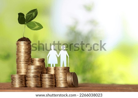 Pension concept. Elderly couple illustration, coins and sprout on wooden table. Space for text Royalty-Free Stock Photo #2266038023