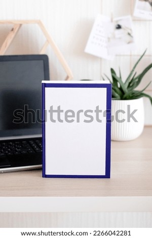 White cover book mockup on workplace with laptop. White book template. White organizer mockup.  Working from home. Freelancer job
