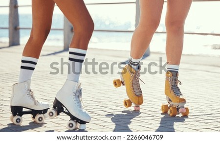 Roller skates or fun friends on promenade for summer holiday activity or travel outdoor. Cool, trendy or funky women skating legs in quad skating or rollerblades with sunshine, beach and ground