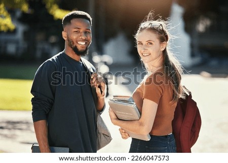 Students, couple or university friends walking together with books for education and learning on campus with scholarship. Portrait of an interracial man and woman together on college or school ground