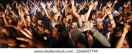 Music, dance and party with crowd at concert for rock, live band performance or festival. New year, energy and disco with audience of fans listening at celebration for techno, rave or nightclub event Royalty-Free Stock Photo #2266047749