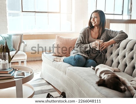 Relax, morning tea and woman with dog on a home living room couch feeling calm with happy lifestyle. Happiness and smile of person with puppy thinking with coffee on peaceful lounge day in a house Royalty-Free Stock Photo #2266048111