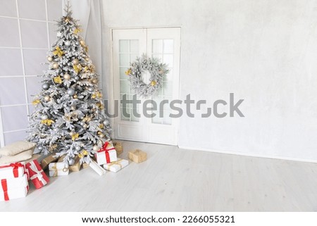 a new year christmas tree with wreath gifts in bright christmas room