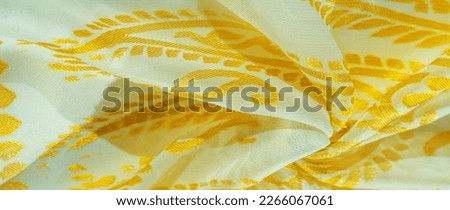 Silk fabric, golden pastels of delicate exquisite colors on a white background, Printed golden paisley photograph.