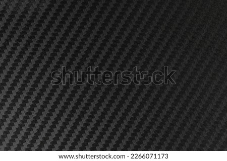 Carbon plastic texture material dark gray color square pattern  background