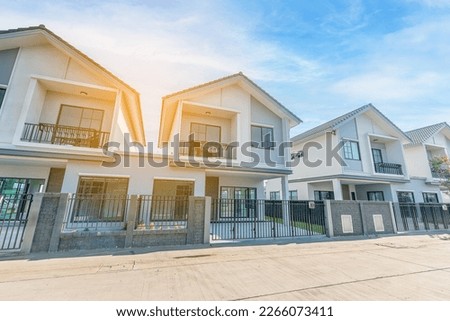 Beautiful exterior of modern twin house just finished, Front View of New Residential house, the architectural design of the exterior with blue sky, The concept for Sale,Rent, Housing, and Real Estate. Royalty-Free Stock Photo #2266073411