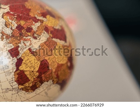 Close up view of the continent of Africa and Europe on a globe on a gray background. Royalty-Free Stock Photo #2266076929