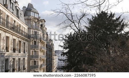 Facade of old buildings, more or less colorful, more or less lit by the sun, in the shade, tall dwellings, more or less concealed by trees, Parisian construction and architecture, Gothic and Baroque