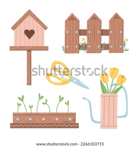 Decorative set of a wooden birdhouse, a fence, a watering can, pot with seedlings and garden shears