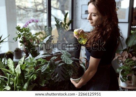 girl florist at work in a flower shop