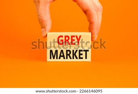 Grey market symbol. Concept words Grey market on wooden block. Beautiful orange table orange background. Businessman hand. Business grey market concept. Copy space.