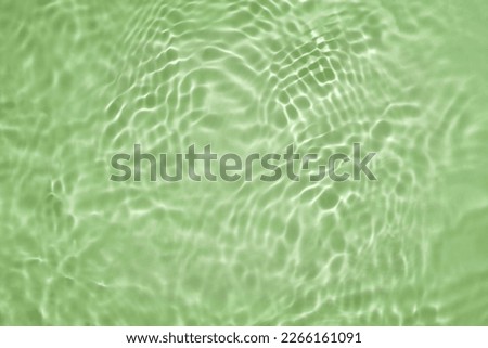 Soft focus cosmetic moisturizer water toner or emulsion green herbal extract abstract background Royalty-Free Stock Photo #2266161091