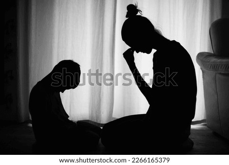 Sad and helpless mother and child at home	 Royalty-Free Stock Photo #2266165379