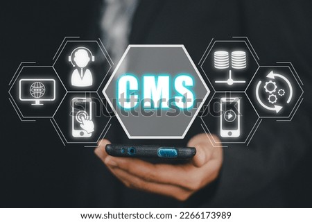 CMS, Content management system concept, Person hand using smart phone with Content management system icon on virtual screen background, business web computer website administration.