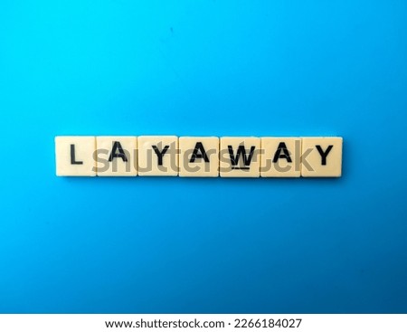 Toys word with the word LAYAWAY on a blue background. Business concept