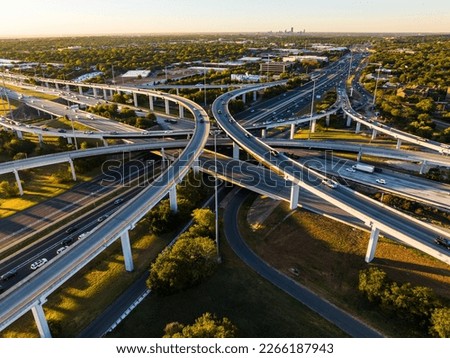 symetrical turnaround interchanges elevated Transportation Highway aerial drone sunrise over busy road way in Austin , Texas , USA Royalty-Free Stock Photo #2266187943