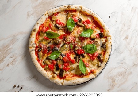 pizza with eggplant, tomatoes and cheese on white marble table top view Royalty-Free Stock Photo #2266205865