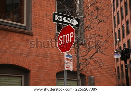 Stop sign in public road warning at intersection and law and order