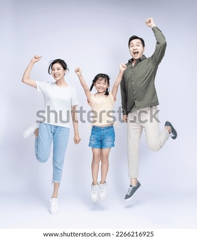 Image of Asian family on background Royalty-Free Stock Photo #2266216925