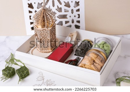 Ramadhan hampers with cookies, tea flower and others. Royalty-Free Stock Photo #2266225703